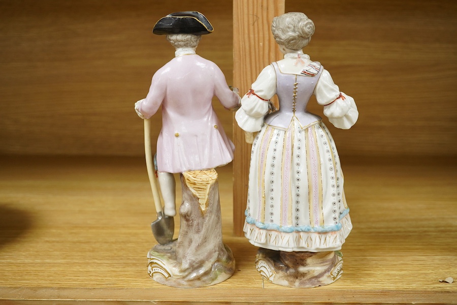 A pair of Meissen style porcelain figures of flower sellers, largest 20.5cm high. Condition - fair, some chipping and losses